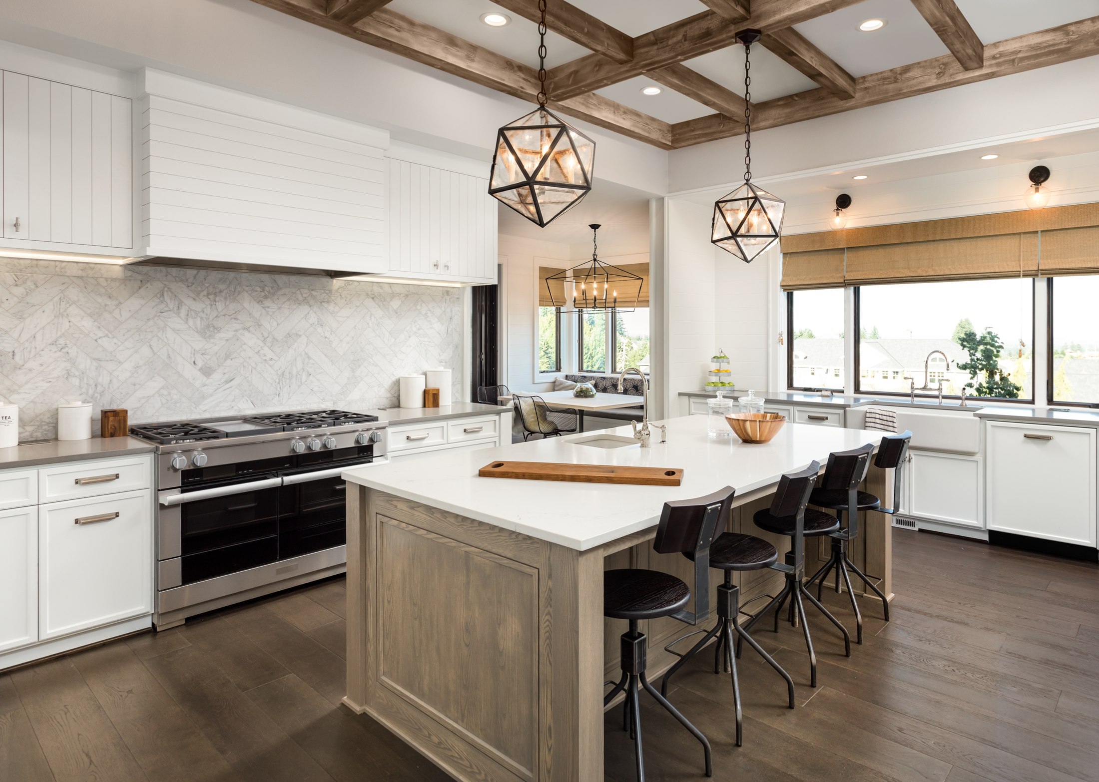 Renovated kitchen with an island and exposed ceiling beams
