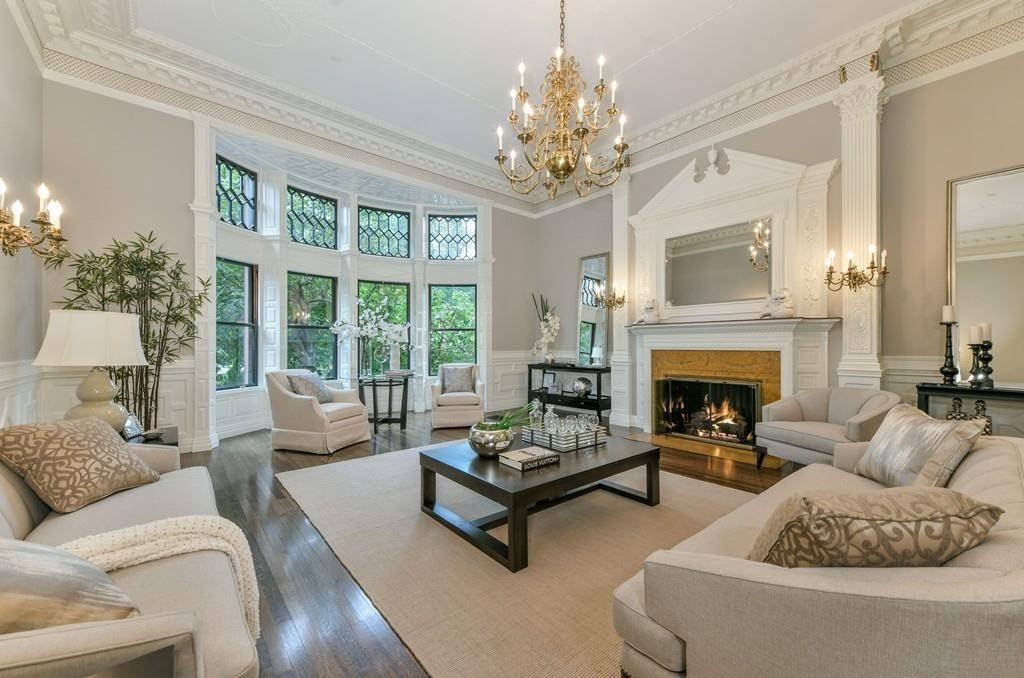 Traditional living room with a fireplace and chandelier